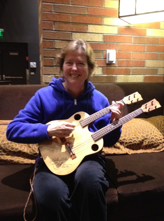 Double neck mando. Top neck is strung like a ukulele. Bottom neck is strung like a viola. Cool, huh? Had a nice sound!